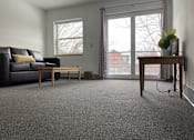 Thumbnail 3 of 15 - a living room with a couch and a table